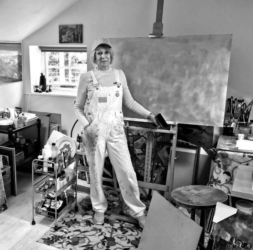 Elizabeth Drayson standing next to a painting
